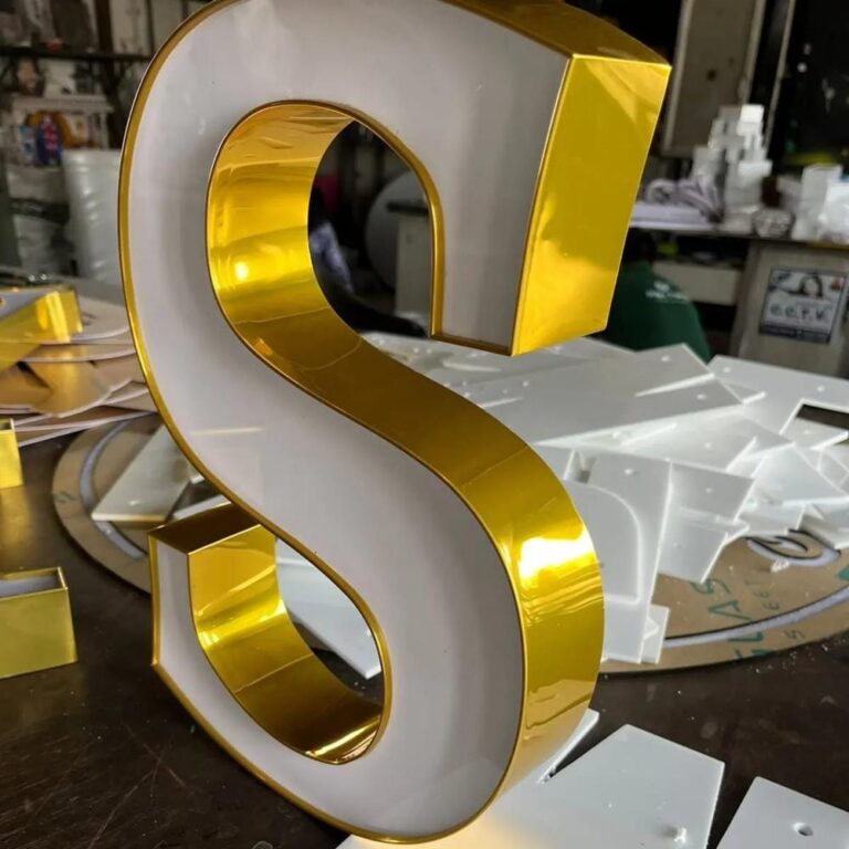 Channelium 3D letter with gold edge strip and white acrylic face