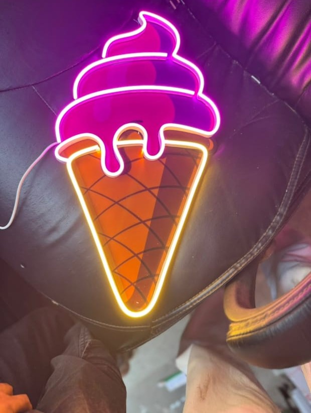 Ice cream cone neon sign in pink and yellow
